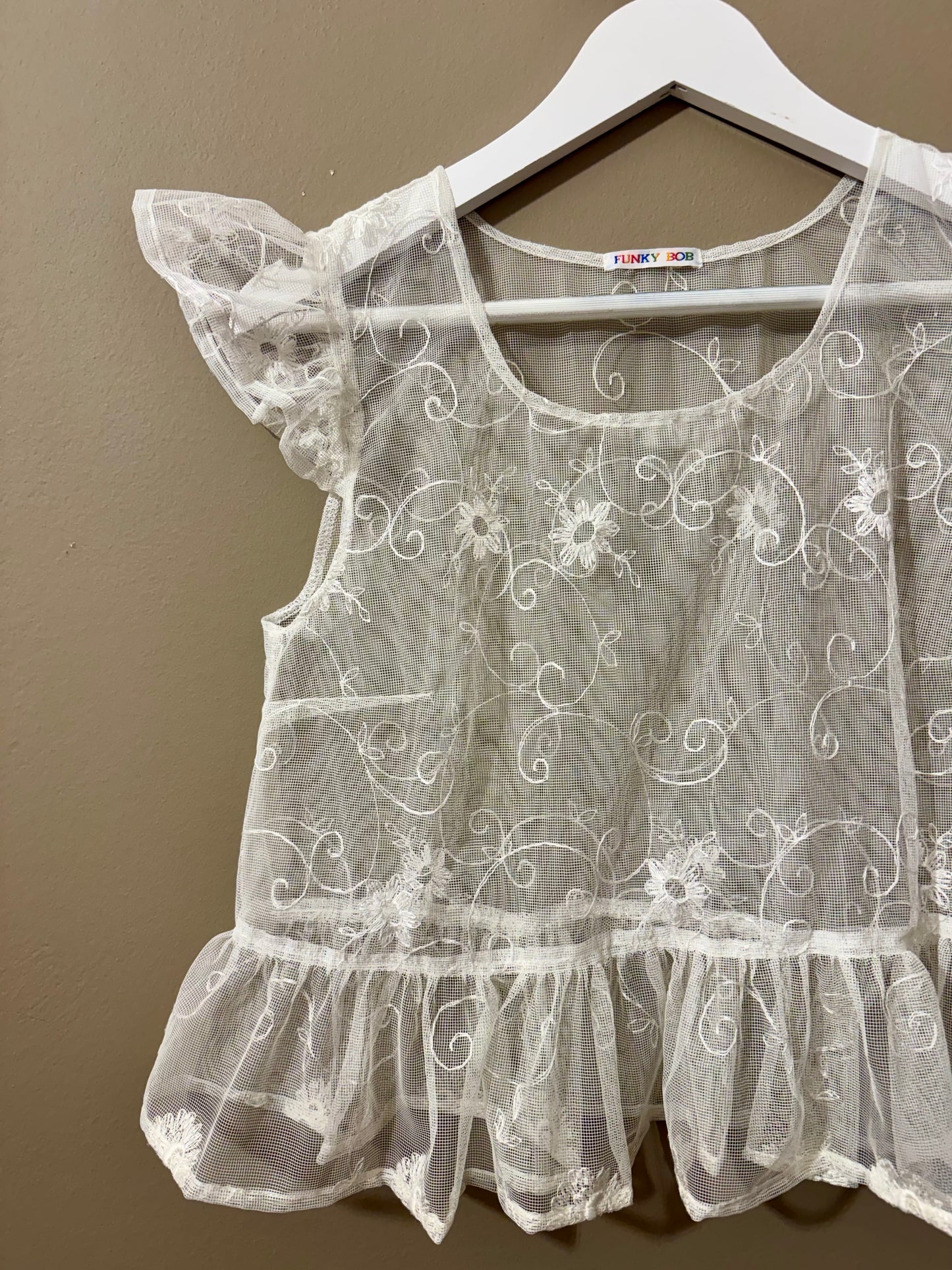 Curtain embroidery top