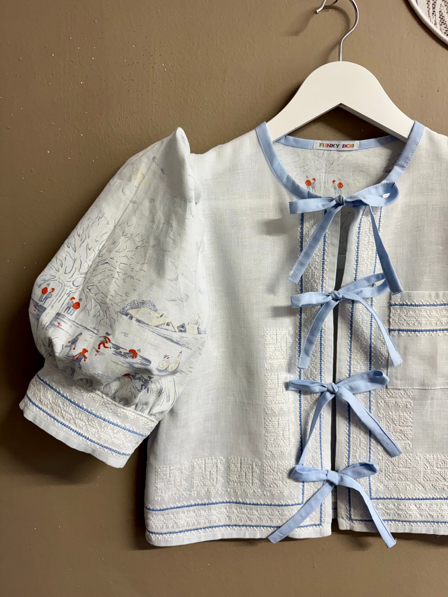 Blue blouse with handmade embroidery