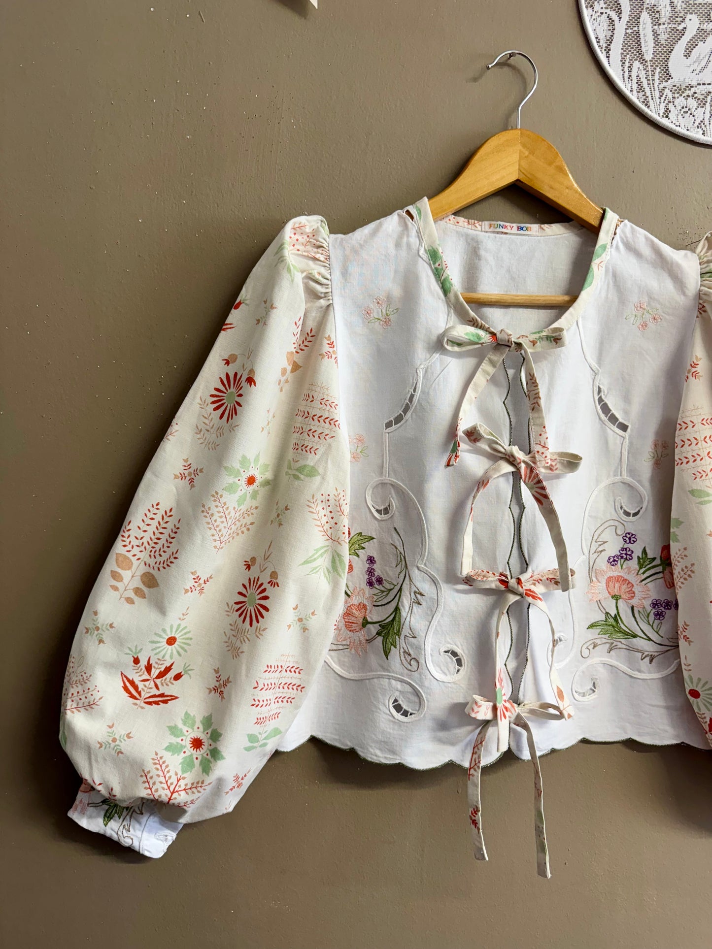 Beige blouse with embroidery