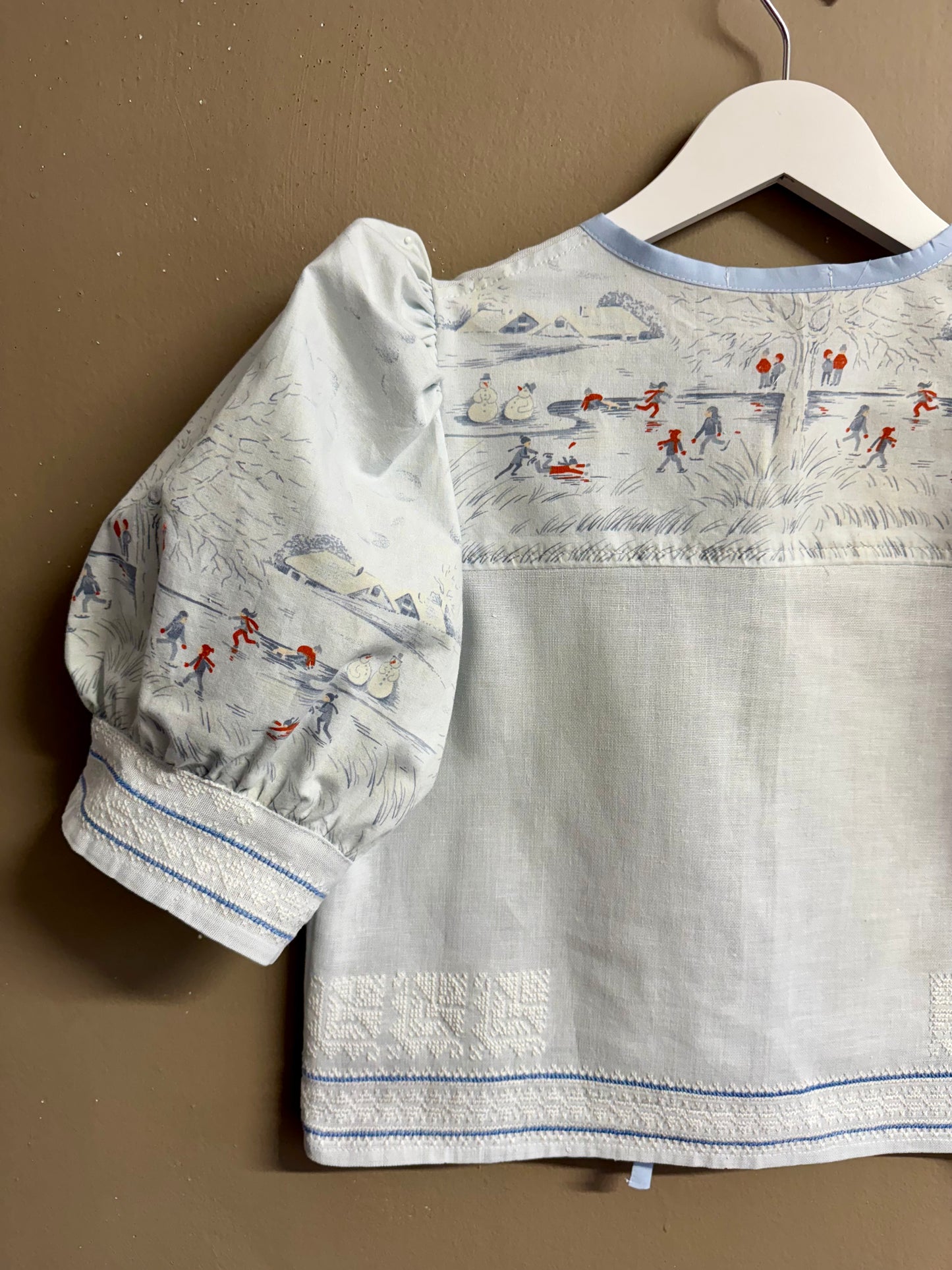 Blue blouse with handmade embroidery
