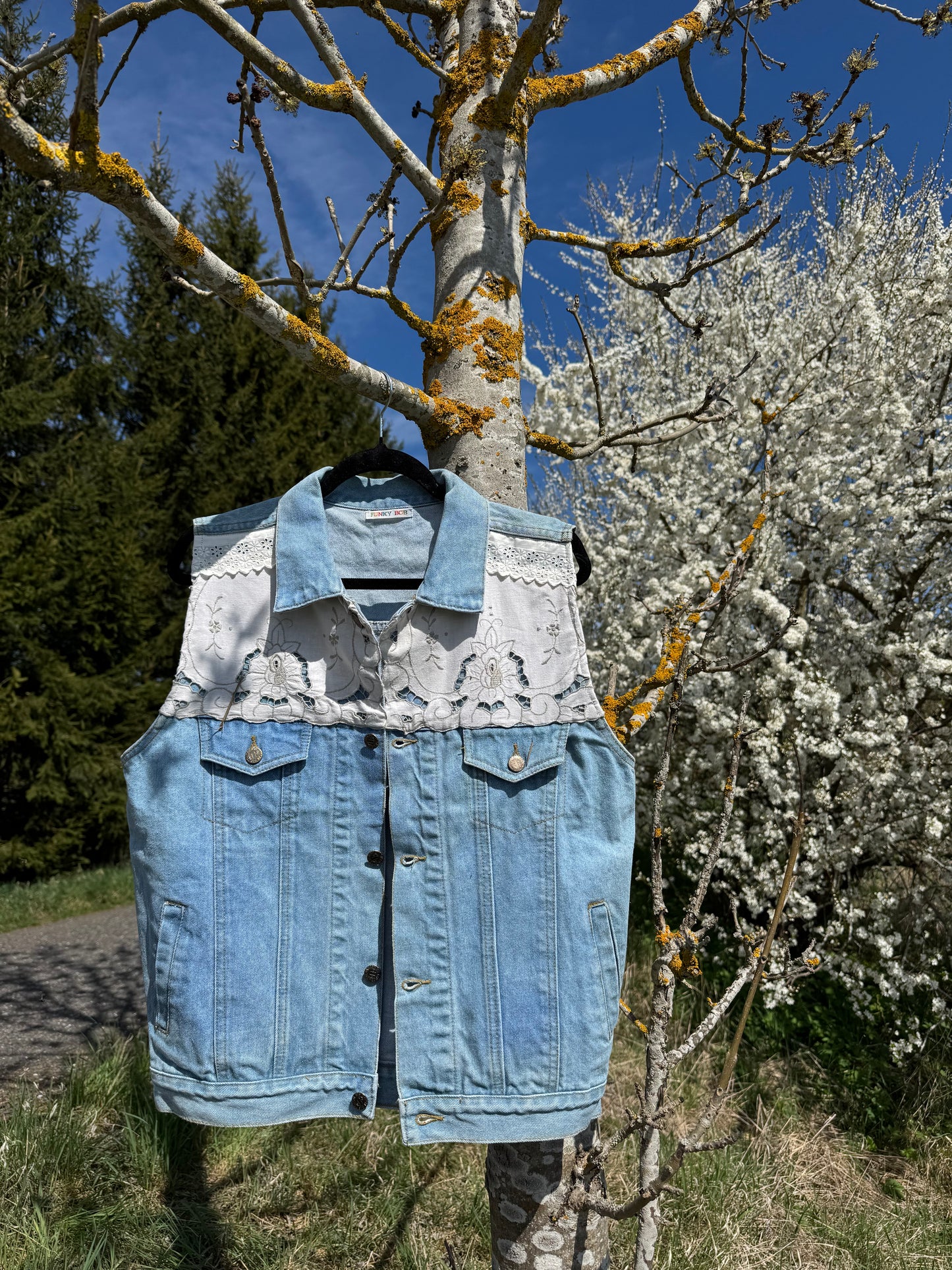 Jeans vest with white embroidery