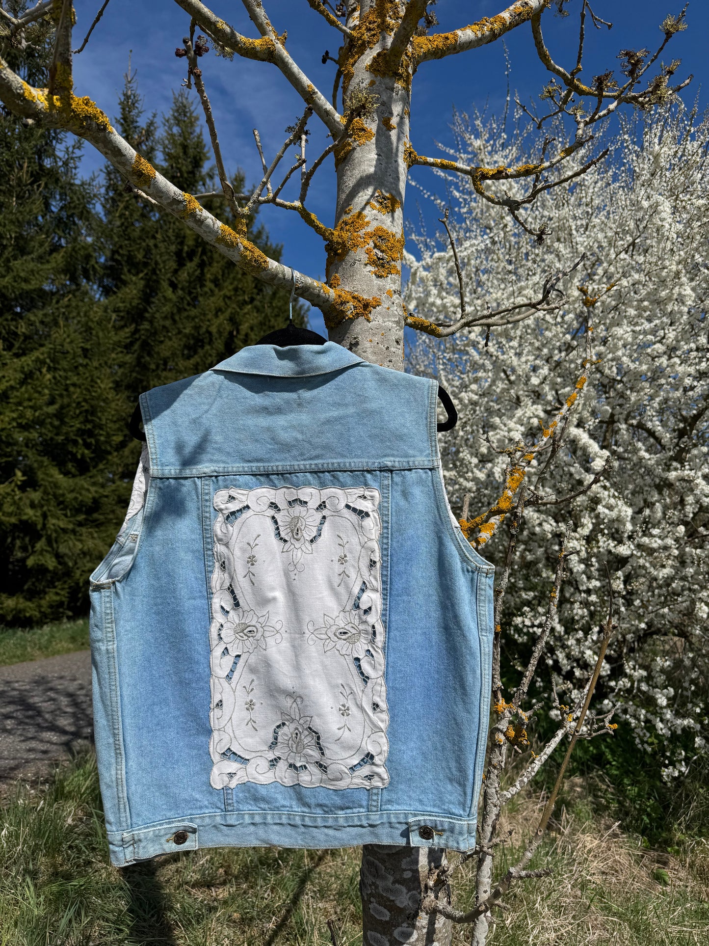 Jeans vest with white embroidery