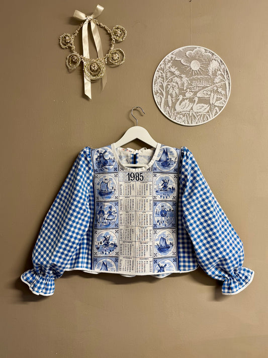 Blue blouse with teatowel