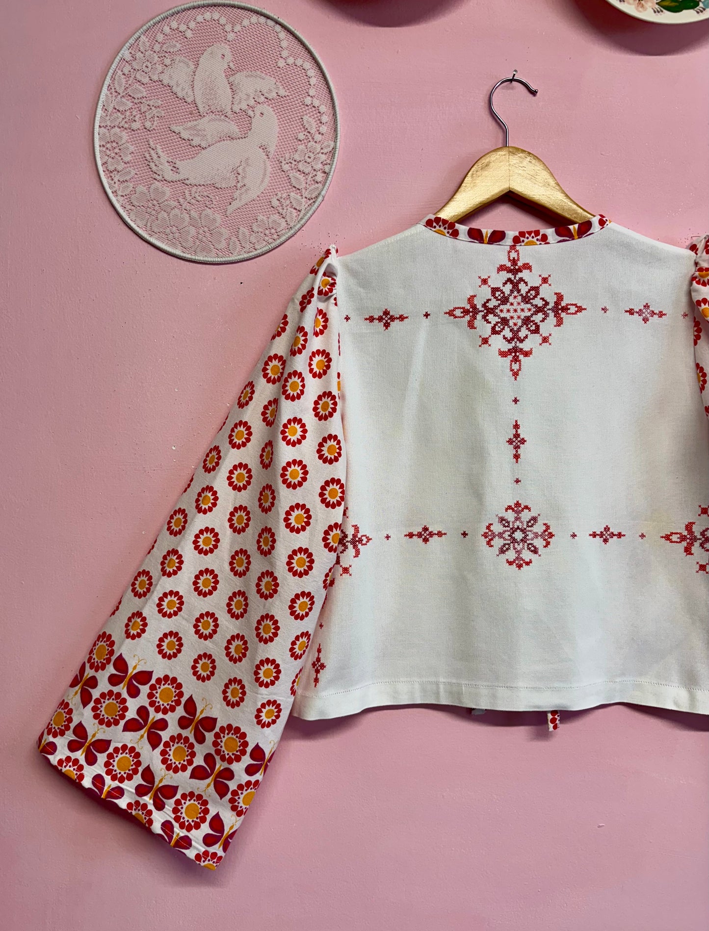 Blouse with red details and embroidery