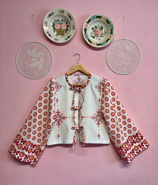 Blouse with red details and embroidery