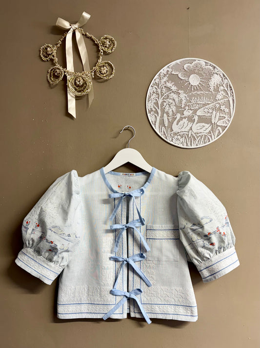 Blue blouse with handmade embroidery
