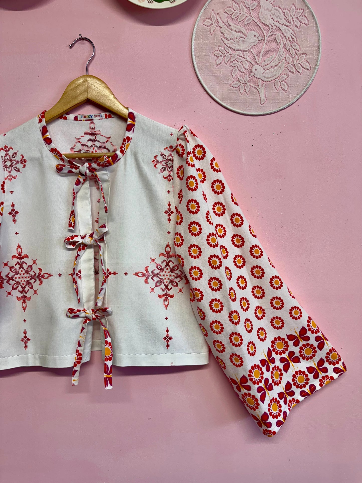 Blouse with red details and embroidery