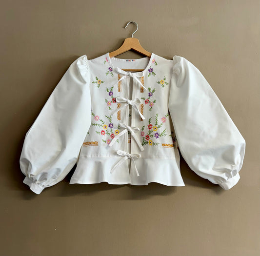 White blouse with flowers embroidery